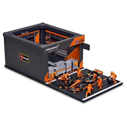 Bburago McLaren Formula Racing 2024 McLaren MCL38 #4 Lando Norris Formula Team Pit Pass Diorama Playset (1:43, Orange/Black)